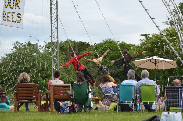 Eleni, Jess and Lisa perform in front of a picnicking audience at Longlands Farm on the Whitbourne Estate
